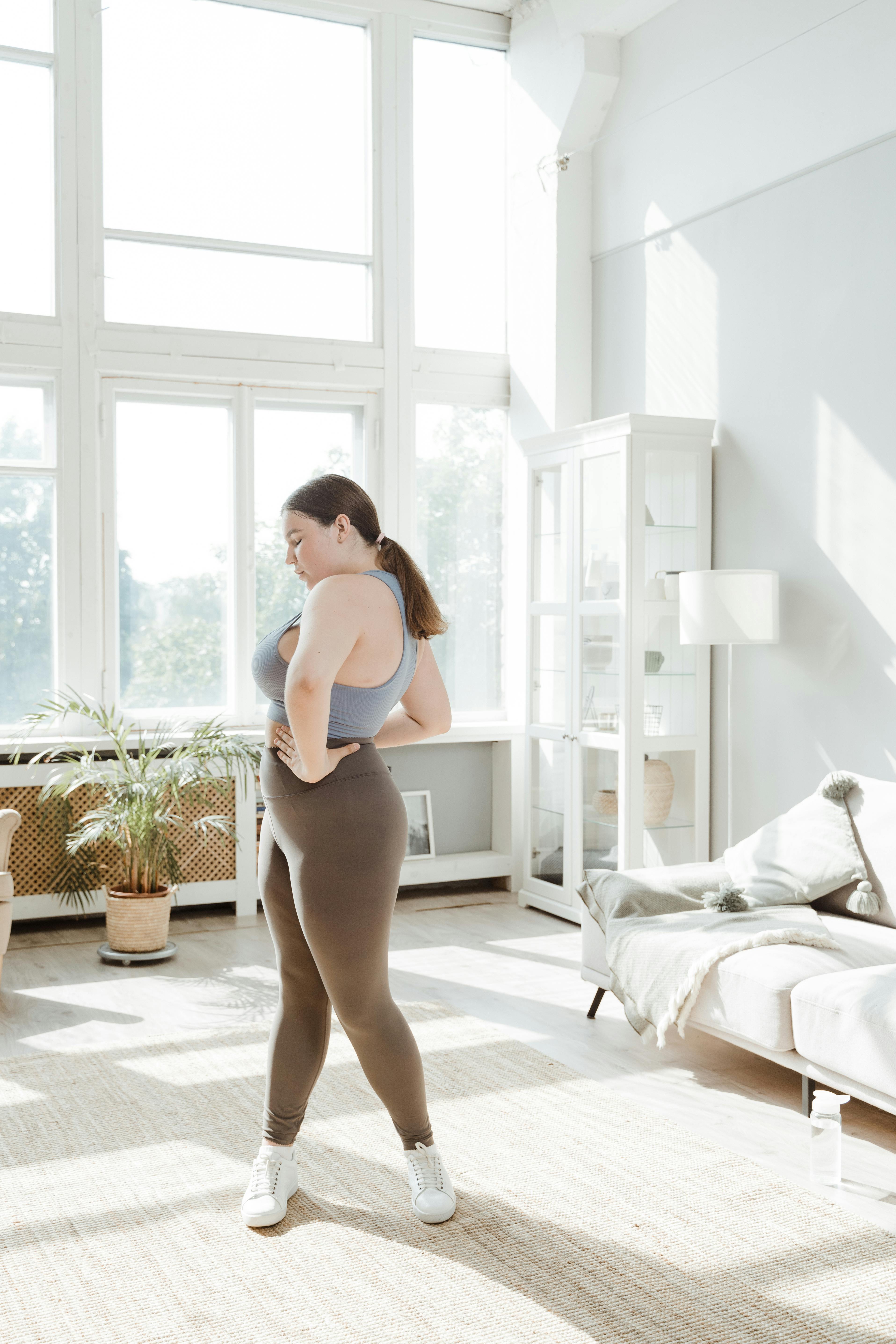 Woman in workout clothes considering her weight management options